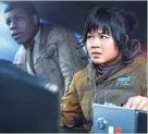  ??  ?? Rose Tico (Kelly Marie Tran, right) and Finn (John Boyega) head out on a mission in “Star Wars: The Last Jedi.”