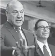  ?? ANDREW HARNIK, AP ?? National Economic Director Gary Cohn, left, and Treasury chief Steven Mnuchin discuss the tax proposals Wednesday at the White House.