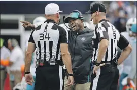  ?? Fred Kfoury III Icon Sportswire ?? BRIAN FLORES, the former coach of the Miami Dolphins, is accusing the NFL and three of its teams of racial discrimina­tion in a lawsuit filed this month.