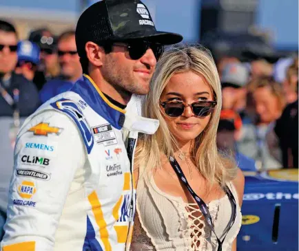  ?? ?? LSU gymnast and social media star Olivia Dunne posed with NASCAR Cup Series driver Chase Elliott on June 25 at Nashville Superspeed­way. Dunne said she’s been paid more than $500,000 for a sponsored post.