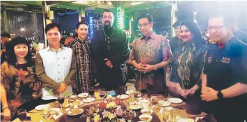  ??  ?? Abd Karim (third right), Lee (right), Hii (second left) and other guests with Seagal (centre) at the VIP table during the AIFFA 2019 opening night.