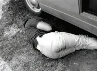  ??  ?? Left: Bruce Mclaren knew how to relax — catching 40 winks before the start of the 1964 NZ Grand Prix at Pukekohe (Photo - Donn Anderson)
Below: The famous Bruce Mclaren team badge designed by UK artist, Michael Turner
Right: A Mclaren get-together at...