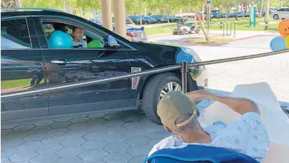  ?? MIAMI JEWISH HEALTH ?? At Miami Jewish Health in South Florida, employees recently arranged for families to do drive-by visits with their loved ones.