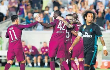  ??  ?? City's players celebrate their goal during the Internatio­nal Champions Cup match against Real Madrid.