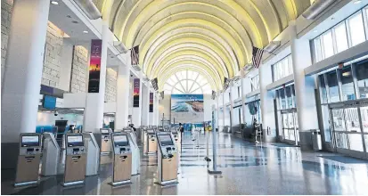  ?? MARIO TAMA GETTY IMAGES ?? Airlines this summer encouraged employees to volunteer for pay cuts, buyouts and early retirement to reduce furloughs.