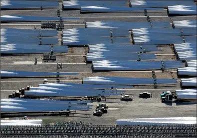  ?? Arkansas Democrat-Gazette/BENJAMIN KRAIN ?? Trucks prepare to haul windmill blades last month from the LM Wind Power factory in the Port of Little Rock.