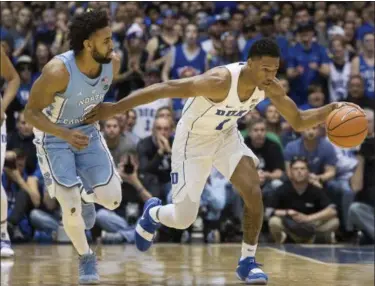  ?? BEN MCKEOWN — THE ASSOCIATED PRESS ?? Duke’s Trevon Duval handles the ball ahead of North Carolina’s Joel Berry II during the first half March 3 in Durham, N.C.