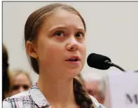  ?? AP/JACQUELYN MARTIN ?? Greta Thunberg addresses a House panel hearing on climate change Wednesday, telling them to “listen to the scientists.” Today in New York, the 16-year-old Swedish activist will lead teenagers in a strike to press for climate action, one of many protests around the world.
