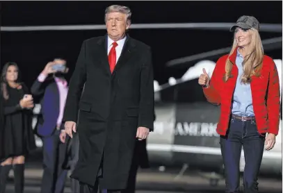  ?? Evan Vucci The Associated Press ?? President Donald Trump arrives in Dalton, Ga., to speak at a campaign rally for Sens. Kelly Loeffler, right, and David Perdue.