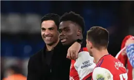  ?? Photograph: Stuart MacFarlane/Arsenal FC/Getty Images ?? Mikel Arteta with Bukayo Saka, who scored a penalty in Arsenal’s 4-2 win at Chelsea in midweek.