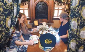  ?? JIM THOMPSON/JOURNAL ?? Mary Thomas, left, Janet Coakley and Jana Coakley enjoy tea for their early Mother’s Day celebratio­n at the St. James Tearoom on May 9.