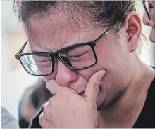  ?? ULET IFANSASTI
GETTY IMAGES ?? Ningsi Ayorbaba, weeps as she awaits news of her husband Paul Ferdinan Ayorbaba, a victim of Lion Air flight JT 610.