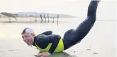  ??  ?? Flynn Steel shows his breakdance ability on St Clair Beach.
