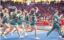  ?? ROBERTO E. ROSALES/JOURNAL ?? The West Las Vegas coed cheerleadi­ng team walks off the floor Saturday after competing in the state high school spirit championsh­ips in Dreamstyle Arena - the Pit.