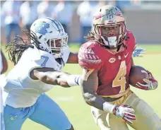  ?? MELINA VASTOLA, USA TODAY SPORTS ?? Dalvin Cook, right, had 4,464 rushing yards and 46 rushing scores in three seasons with Florida State.