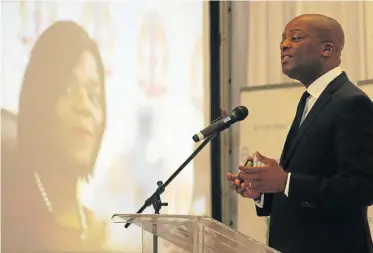  ?? Picture FREDLIN ADRIAAN ?? LOOKING FORWARD: With a slide of former public protector Thuli Madonslea on the screen, Justice Malala speaks yesterday