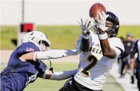  ?? Eric Christian Smith/Contributo­r ?? Fort Bend Christian wide receiver Bryan Domino catches a pass in Saturday’s victory over Second Baptist at Delmar Stadium.