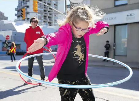  ?? NICK BRANCACCIO/WINDSOR STAR ?? Ava Wilson, 6, shows her hula hoop skills at the St. Clair College display during Open Street Windsor on Sunday.