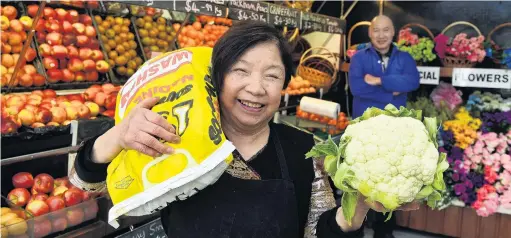  ?? PHOTO: STEPHEN JAQUIERY ?? All smiles . . . Nancy Young in the Balclutha greengroce­rs she and her late husband Ngok opened 50 years ago. Son and business partner Roger stands behind.