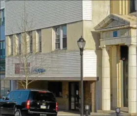  ?? DIGITAL FIRST MEDIA FILE PHOTO ?? The former PEAK Center at 315 West Main Street in Lansdale is next to 311 West Main, at right, in 2013.