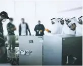  ?? Police Dubai ?? Police inspect the broken safe in an apartment in City Walk. The suspect drilled through the steel with tools he bought at a hardware store