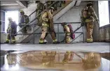  ?? AMANDA VOISARD / AMERICAN-STATESMAN ?? Left: The Austin Fire Department also commemorat­es the 17th anniversar­y of 9/11 with a stair climb at the Pleasant Valley drill tower.