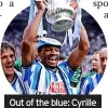  ?? ?? Out of the blue: Cyrille Regis of Coventry lifts the trophy in 1987