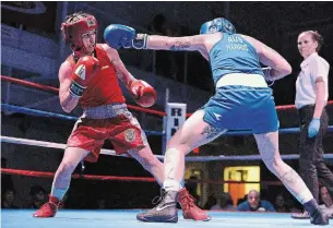  ?? IAN STEWART SPECIAL TO THE RECORD FILE PHOTO ?? Mandy Bujold, in red, battles Australian Kristy Harris in Kitchener in 2019.