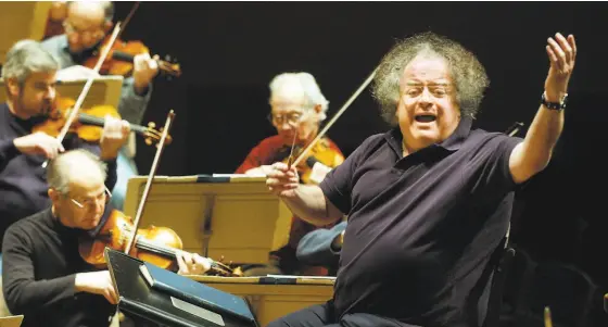  ?? Steven Senne / Associated Press 2004 ?? James Levine leads a rehearsal of the Boston Symphony Orchestra. The longtime Met conductor’s death was scantly mourned.