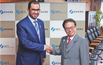  ?? Courtesy: Adnoc ?? Adnoc Group CEO Dr Sultan Ahmed Al Jaber meets with Hiroshige Seko, Japan’s Minister of Economy, Trade and Industry on Tuesday.