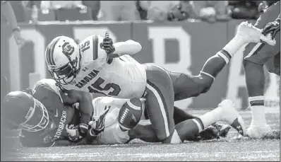  ?? Arkansas Democrat-Gazette/STEPHEN B. THORNTON ?? Arkansas wide receiver Keon Hatcher loses the ball as he is tackled by South Carolina cornerback Jimmy Legree (15) after a 50-yard gain in the third quarter of Saturday’s game at Reynolds Razorback Stadium in Fayettevil­le. It was one of two fumbles...