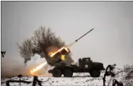  ?? VADIM GHIRDA-ASSOCIATED PRESS ?? Ukrainian military fires from a multiple rocket launcher at Russian positions in the Kharkiv area, Ukraine, Saturday.