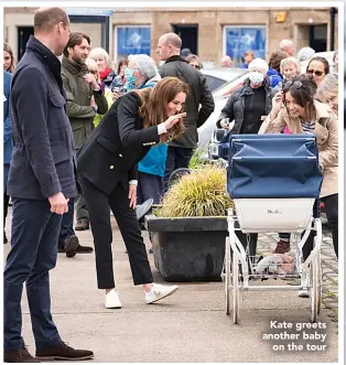  ??  ?? Kate greets another baby on the tour