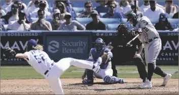  ?? AP PHOTO/MARK J. TERRILL ?? Detroit Tigers’ Miguel Cabrera (right) hits a two-run home run as Los Angeles Dodgers relief pitcher Phil Bickford (left) watches along with catcher Will Smith and home plate umpire Brian Knight during the eighth inning of a baseball game on Sunday in Los Angeles.