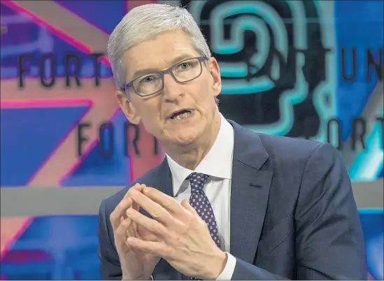  ?? Aleksandar Plavevski EPA/Shuttersto­ck ?? APPLE is among the firms expected to repatriate billions of dollars to the United States due to the new tax law. Above, Apple Chief Executive Tim Cook last month.
