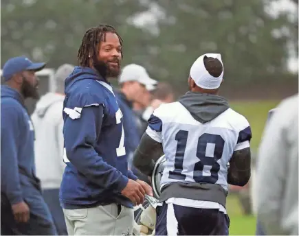  ?? LM OTERO/AP ?? Defensive lineman Michael Bennett, left, talks with wide receiver Randall Cobb (18) during his first practice with the Cowboys since being traded by the Patriots last week.
