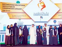  ??  ?? Winners of the conservati­on award with Saeed Al Tayer.