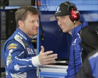  ?? ASSOCIATED PRESS FILE PHOTO ?? Driver Dale Earnhardt Jr., left, talks with crew chief Greg Ives prior to a NASCAR Cup series auto race at the Charlotte Motor Speedway in May. Earnhardt has struggled this season, and fans have criticized Ives.