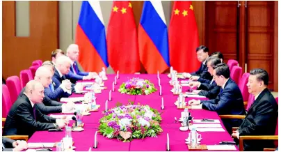  ?? AP ?? Russian President Vladimir Putin (left) and Chinese President Xi Jinping (right) attend the meeting at Friendship Palace in Beijing Friday, April 26. Several world leaders met over two days to fine tune China’s US$5 trillion Belt and Road Initiative.