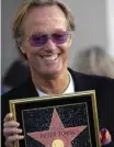  ??  ?? In this file photo Actor Peter Fonda attends a ceremony honoring him with a star on the Hollywood Walk of Fame in Hollywood, California. — AFP photos