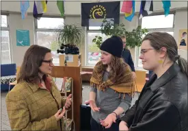  ?? CHRIS WILLIAMS/EDUCATION MINNESOTA VIA AP ?? Bloomingto­n Jefferson senior Shae Ross, center, joined Lieutenant Governor Peggy Flanagan, left, at an event promoting proposed legislatio­n to prevent books bans based on ideology at Como Park High School in St. Paul, Minn., on March 21, 2024.