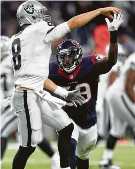  ?? Karen Warren / Houston Chronicle ?? Texans linebacker Whitney Mercilus consistent­ly put pressure on Raiders quarterbac­k Connor Cook in the wild-card playoff game.