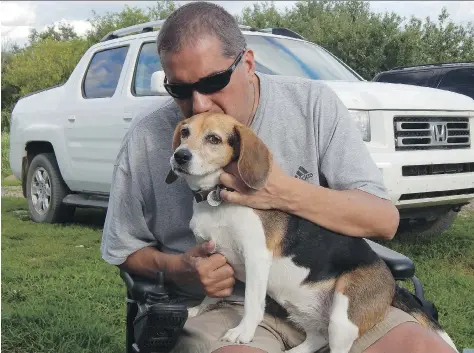  ?? FACEBOOK ?? Robert Carignan was out with his beagle Molly in Saskatoon on Sunday when a man pulled him out of his wheelchair and beat him.