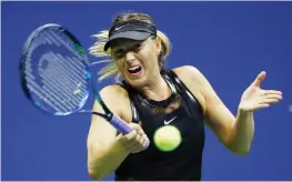  ??  ?? NEW YORK: Maria Sharapova of Russia returns a shot during her first round Women’s Singles match against Simona Halep of Romania on Day One of the 2017 US Open at the USTA Billie Jean King National Tennis Center yesterday in the Flushing neighborho­od of...