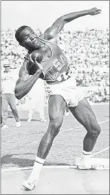  ?? Associated Press ?? JOHNSON competes in the shot put portion of the Olympic decathlon at the 1960 Games.