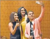  ?? RAJ K RAJ/HT ?? Athlete Hima Das takes a selfie with shooter Heena Sidhu (left) and badminton player PV Sindhu.