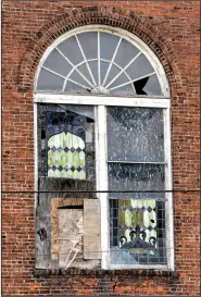  ?? Arkansas Democrat-Gazette/CARY JENKINS ?? A large window on the front of Centennial Baptist Church is shown in Helena-West Helena.