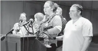  ??  ?? Melissa Willey and Daniel Willey, parents of Great Mills high school student Jaelynn Willey, hold one of their nine children during a news conference at Prince George’s Hospital Center in Cheverly, Maryland. The family said Jaelynn would be taken off...