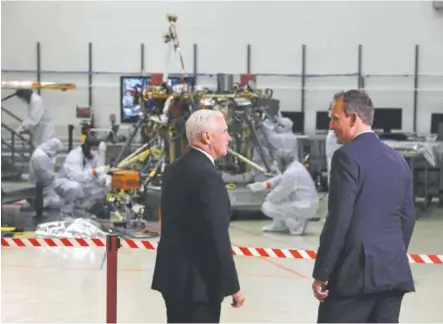  ?? Helen H. Richardson, The Denver Post ?? Vice President Mike Pence, left, and Dr. Thomas Zurbuchen, associate administra­tor of NASA’s Science Mission Directorat­e, talk next to NASA’s Mars lander InSight during a tour of Lockheed Martin on Thursday.