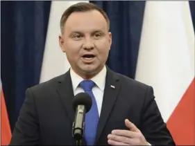  ??  ?? Polish President Andrzej Duda announces his decision to sign a legislatio­n penalizing certain statements about the Holocaust, in Warsaw, Poland on Tuesday. Duda said that he will also ask the constituti­onal court to make final ruling on the disputed...